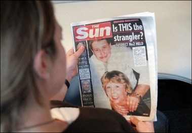 A woman reads the front page of the 20 December 2006 edition of The Sun, featuring pictures of a man named by the paper as 48 year-old Steve Wright (top), one of two suspects currently in police custody in connection with the murders of five prostitutes in Ipswich. Police probing the killings of five prostitutes in the English town of Ipswich were sharing notes with a neighboring force trying to resolve sex worker murders dating back to 1992.(AFP