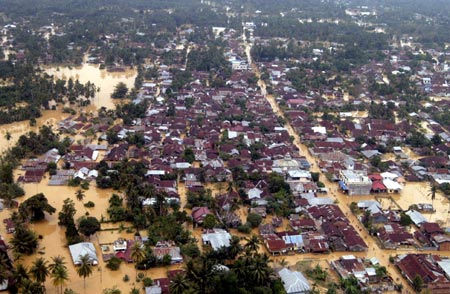 An aerial view shows schools building flooded in the district of Aceh Tamiang, Aceh province on December 24, 2006. Floods in Indonesia's Aceh and North Sumatra province have left at least 22 people dead and six missing, Health Ministry official said on Sunday. 