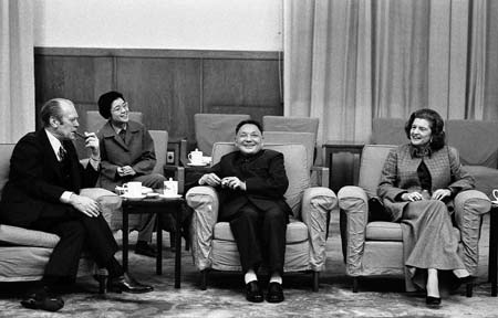 Former U.S. President Gerald Ford (L) and his wife Betty (R) is pictured with Vice Premier Deng XiaoPing (C) and Dengs interpreter (2nd L) having a chat during an informal meeting in Peking, China in this December 3, 1975 file photo. Ford, 93, has died, according to a statement from his wife Bette on December 26, 2006. 