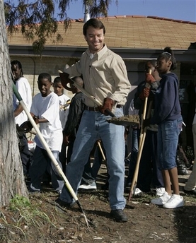 John Edwards shovels with student volunteers as he works in the backyard of a house in an area affected by Hurricane Katrina in New Orleans Wednesday, Dec. 27, 2006. The former Democratic vice presidential nominee is running for president for a second time, his campaign said Wednesday.(AP