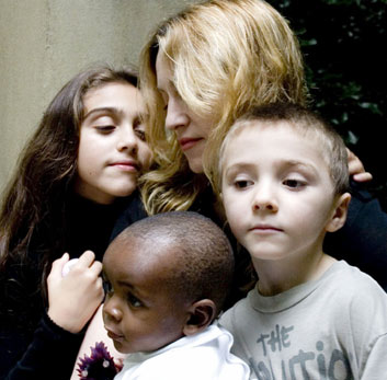 U.S. singer Madonna poses with her daughter Lourdes (L), son Rocco (R) and one-year-old Malawian boy David Banda in central London in this handout photograph released October 26, 2006.