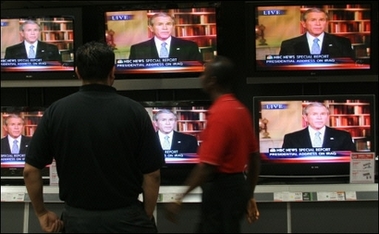 People at an electronics store in Maryland watch US President George W. Bush give a televised address on his new plan for the war in Iraq. Bush ordered more than 20,000 more troops into Iraq, as he admitted to mistakes there and warned Iraqi leaders they would lose US support if they failed to quell the violence. [AFP]