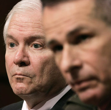 Secretary of Defense Robert Gates (L) listens during the Senate Armed Services Committee hearing about Iraq on Capitol Hill in Washington January 12, 2007. Next to Gates is Chairman of the Joint Chiefs Gen. Peter Pace. 