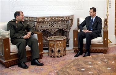 Syrian president Bashar Assad, right, meets with Iranian defense minister Mostafa Najjar in Damascus on Sunday March 11, 2007. 