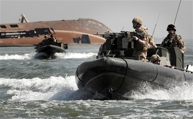 In this recent but undated image released by the British Royal Marines Sunday March 25, 2007, marines from 539 Assault Squadron Royal Marines conduct operations on waterways in the Basra region of southern Iraq as part of Operation Troy. Iranian naval vessels on Friday, seized 15 British sailors who had boarded a merchant ship in Iraqi waters of the Persian Gulf. British officials do not know where Iran is holding 15 sailors and marines captured in the Persian Gulf, and requests for access to them have been denied, the Foreign Office said Sunday as Tehran again protested what it called their illegal entry into Iranian waters. (AP
