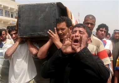 Relatives carry the coffin of Ahmed Frayih in the Shiite enclave of Sadr City in Baghdad, Iraq, Monday, April 16, 2007. Ahmed was kidnapped by unknown men and found killed on Monday. (AP 