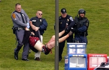 An 
 
 unidentified person is carried out of Norris Hall at Virginia Tech in Blacksburg, Va. on Monday, April 16, 2007, after a shooting incident. 