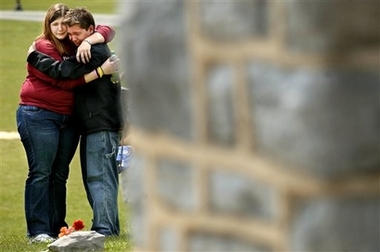 Mourners, who wished to remain anonymous, console each other on Wednesday, April 18, 2007, 