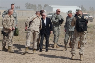 U.S. Defense Secretary Robert Gates arrives at Camp Falluja, Iraq, after visiting Baghdad, Thursday, April 19, 2007, and is greeted by soldiers and top military commanders. 