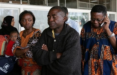 Relatives of a passenger on the Kenya Airways plane that crashed in Cameroon mourn at the Jomo Kenyatta airport in Nairobi, Kenya, Saturday, May 5, 2007