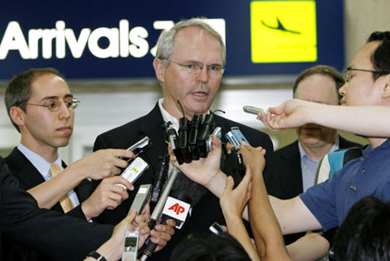 Christopher Hill (C), U.S. envoy to the six-party talks, answers reporters' questions upon his arrival from Tokyo at an airport in Seoul July 15, 2007. 