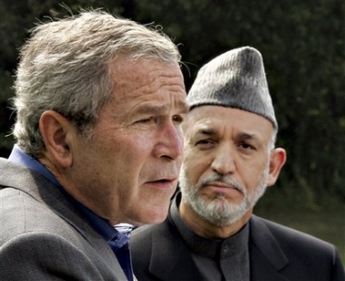 President Bush, left, accompanied by Afghanistan's President Hamid Karzai, right, speaks during their joint press conference, Monday, Aug. 6, 2007, at Camp David, Md. (AP 
