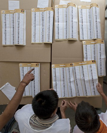 Workers start to count election votes in Afghanistan