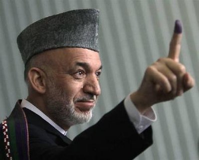 Afghan minister claims Karzai poll win, UN says wait
