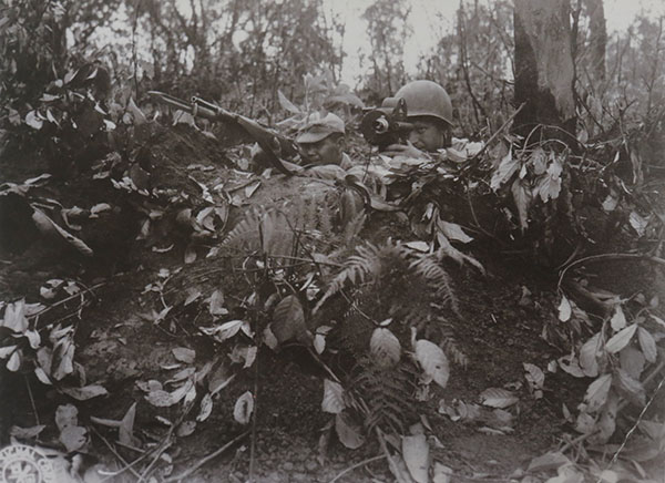 Cameras and carbines capture life during wartime