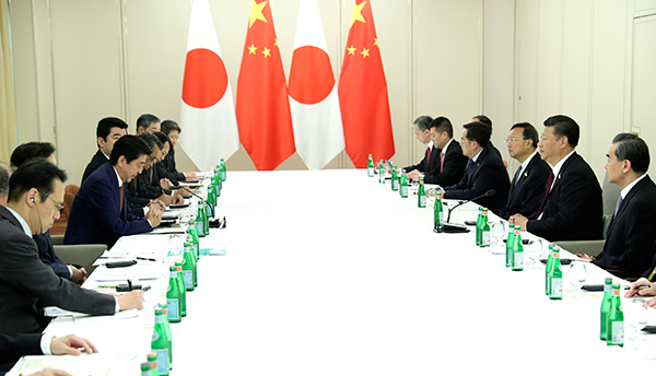 Xi, Abe meet on ties, reaffirm readiness to strengthen partnership