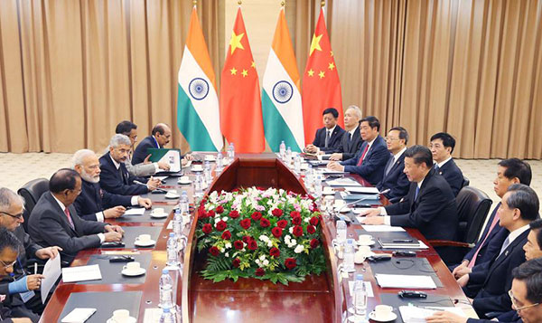 Xi, Modi vow close cooperation
