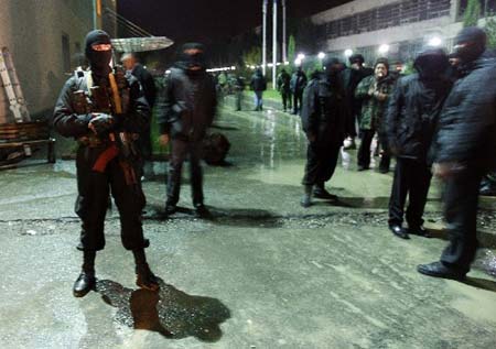 Police stand guard by the television station Imedi in Tbilisi November 7, 2007. 