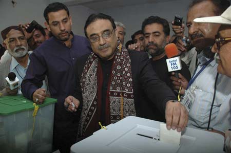 Asif Ali Zardari, widower of slain opposition leader Benazir Bhutto, casts his ballot inside a polling station in Nawabshah, 320 km (200 miles) from Karachi, Feb. 18, 2008.