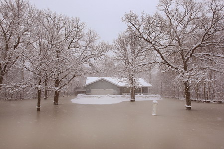 Snowstorm slows Fargo's recovery from flood