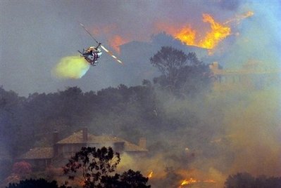 Wildfire burns homes in coastal Calif. enclave