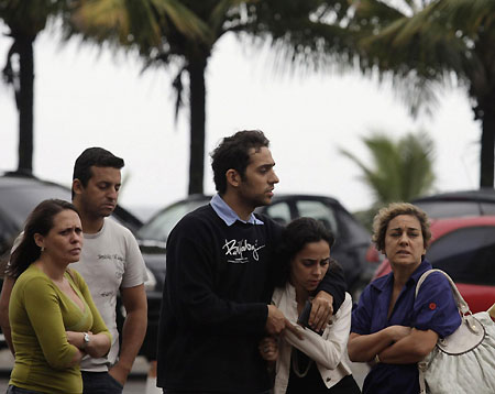 Distraught relatives wait for information at Brazil hotel