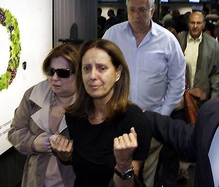 Distraught relatives wait for information at Brazil hotel