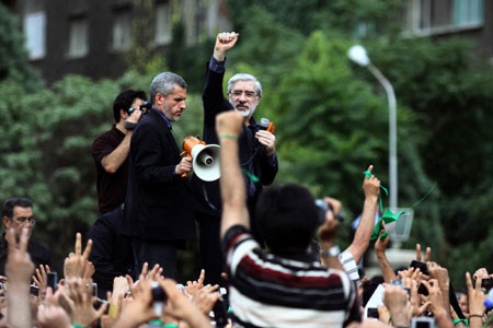 Hundreds of thousands stage somber rally in Iran