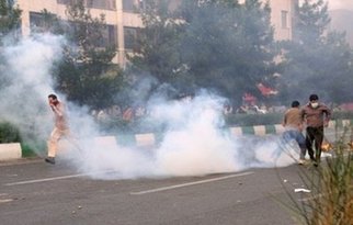 Defiant Tehran protesters battle police
