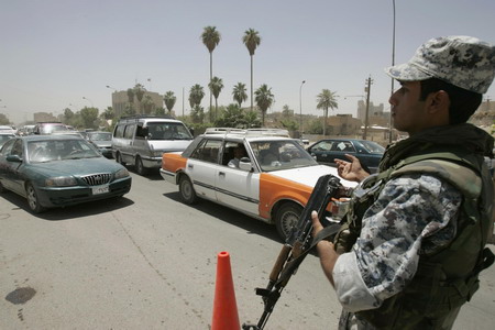 Iraqis celebrate US pullback but bombing kills 33