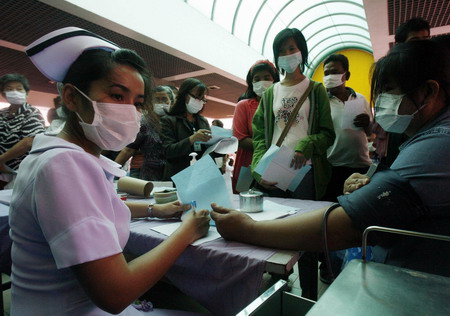 Spideman wears mask in flu-hit Bangkok