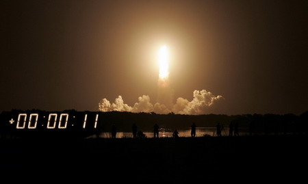 Space shuttle Discovery lifts off