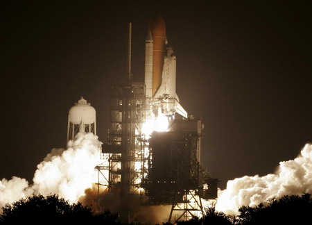 Space shuttle Discovery lifts off