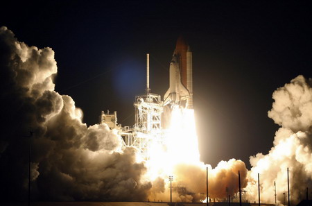 Space shuttle Discovery lifts off