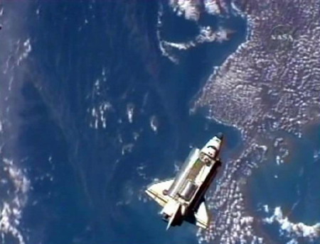 Shuttle Discovery reaches space station