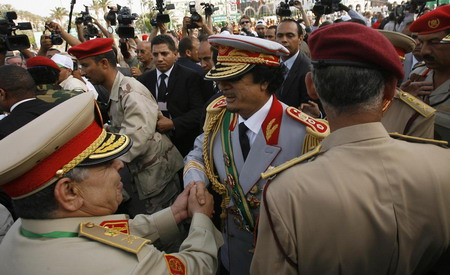 Hugs from Chavez as Gaddafi's Libya reaches 40