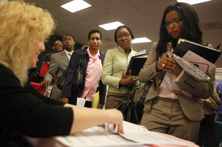 US new jobless claims drop slightly