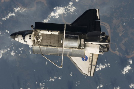 Space shuttle begins its journey home