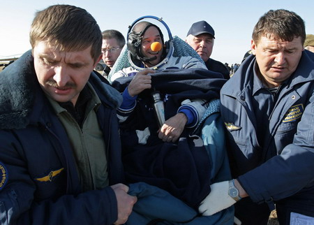 Russian spacecraft with circus tycoon lands safely