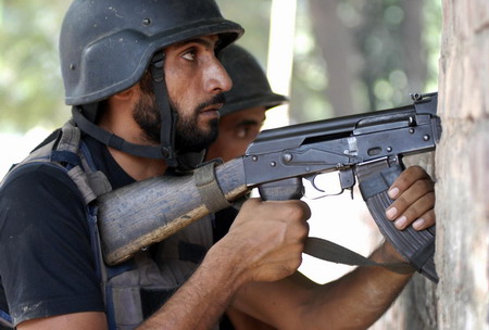 Gunmen, bomber hit 4 sites in Pakistan, 31 die