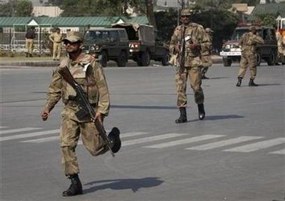 Gunmen, bomber hit 4 sites in Pakistan, 37 die