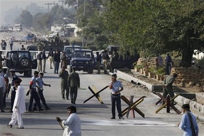 Blasts at Pakistan air base, wedding bus kill 24