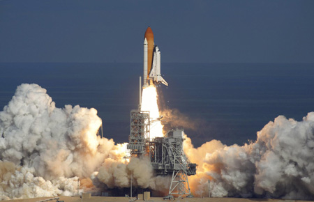 Space shuttle Atlantis lifts off on supply mission