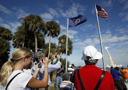 Space shuttle Atlantis lifts off on supply mission