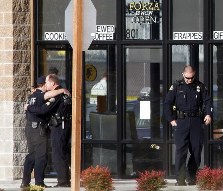 4 cops shot dead at US coffeehouse