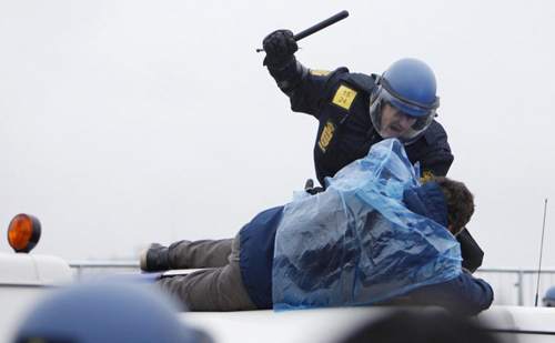 Police battle protesters at climate change conference