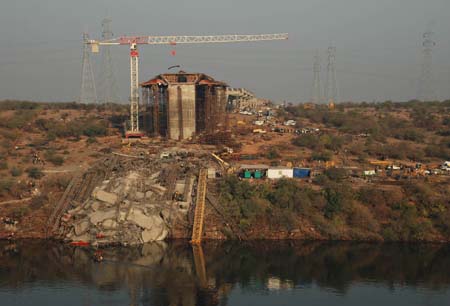 Police say 9 die in bridge collapse in west India