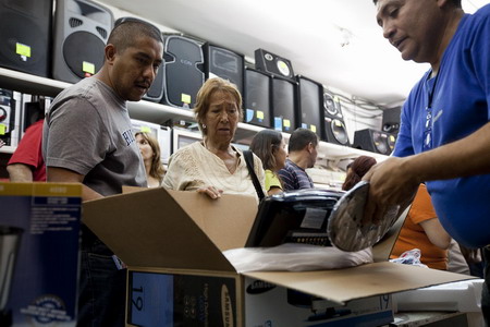 Venezuelans in shopping spree after devaluation