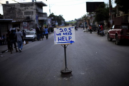 Hunger and hope, thirst and frenzy grip Haiti