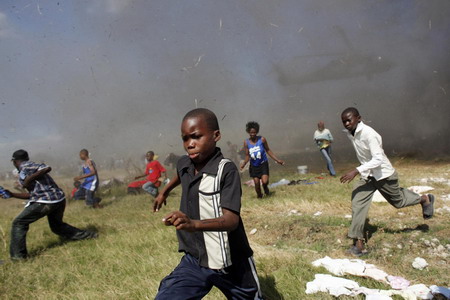 Hunger and hope, thirst and frenzy grip Haiti